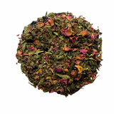 Ball of mixed dried tea leaves on a white background