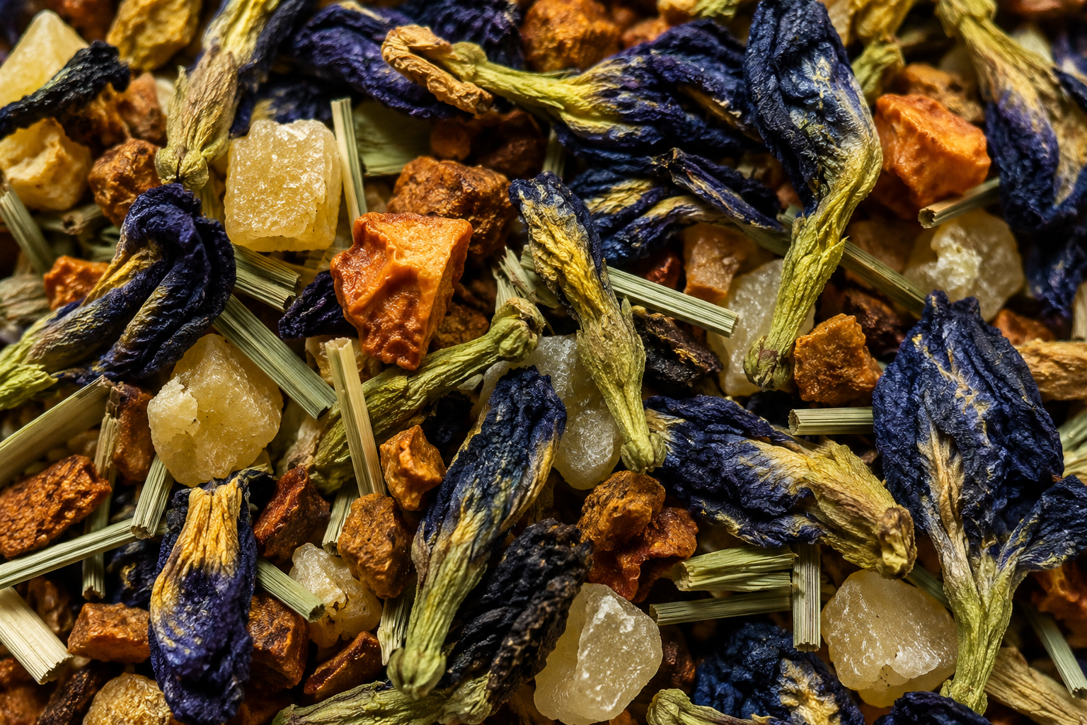 Close-up of a mix of dried herbs and flowers with blue and orange colors.