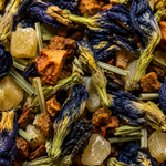 Close-up of a mix of dried herbs and flowers with blue and orange colors.
