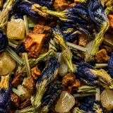 Close-up of a mix of dried herbs and flowers with blue and orange colors.