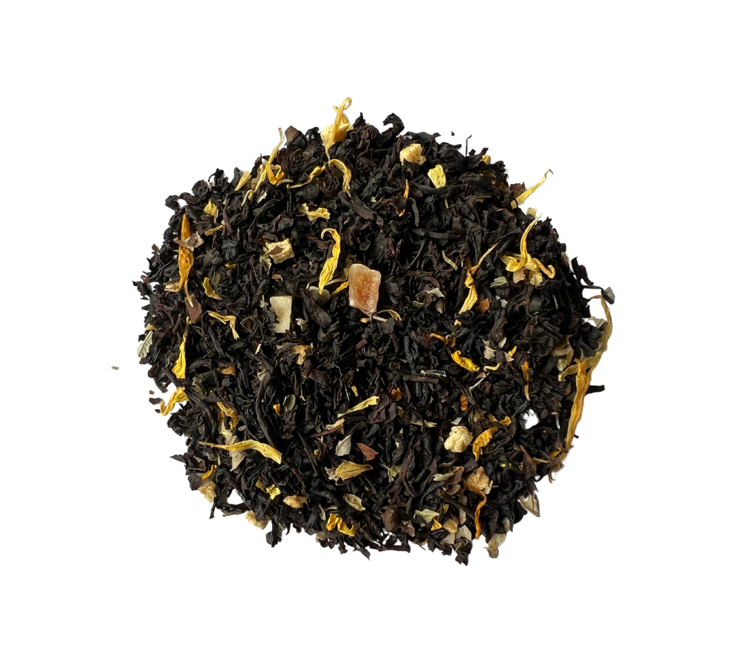 A pile of black tea leaves with pieces of apricot and petals of calendula and sunflower mixed in.