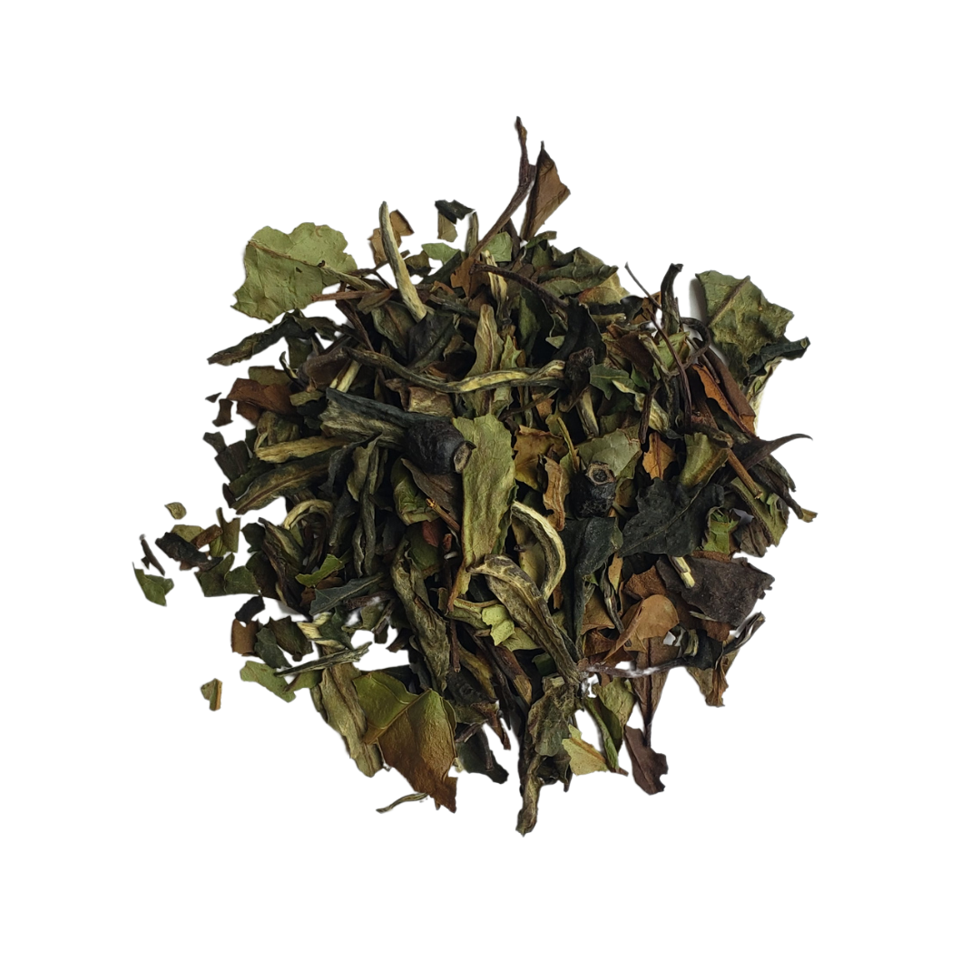 A pile of loose leaf tea mix with visible natural ingredients, likely to be used for making a cup of tea.