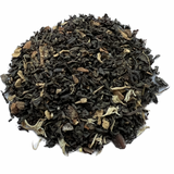Chocolate Chai Tea in a cup, loose-leaf chai blend with cocoa and spices, spiced black tea with cinnamon and nutmeg.