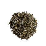 A close-up image of dried Lavender Mint tea leaves, showcasing a mix of purple and green hues.