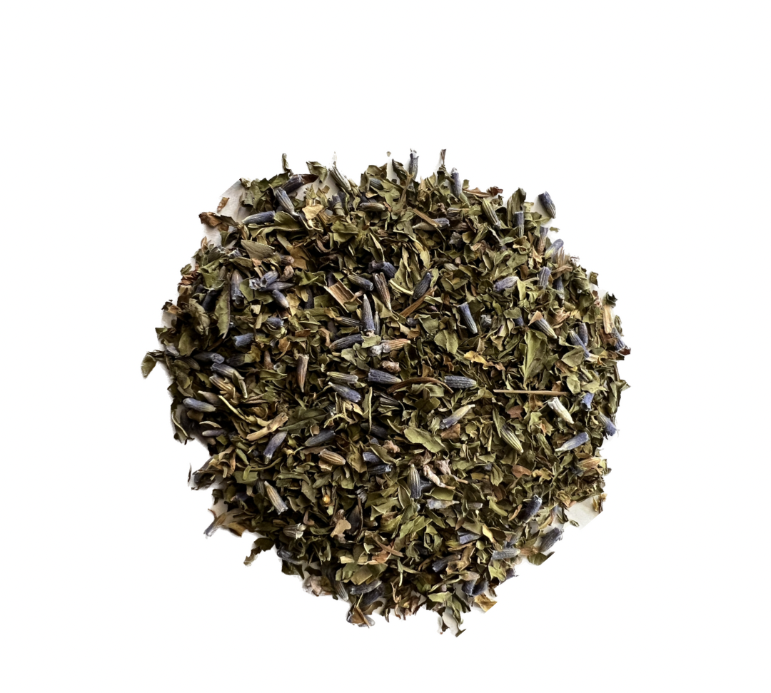 A close-up image of dried Lavender Mint tea leaves, showcasing a mix of purple and green hues.