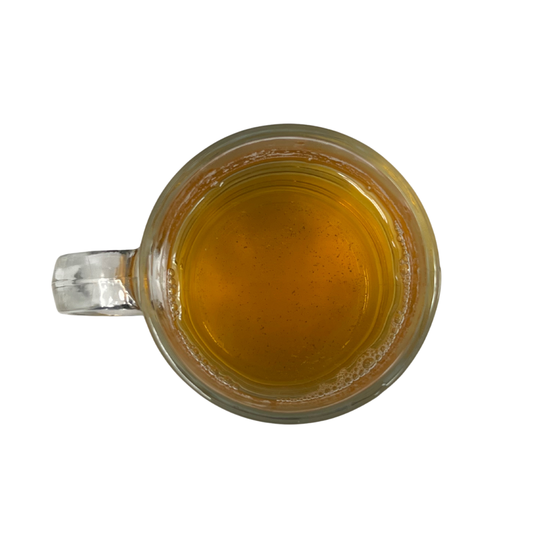 Steaming cup of Milk Oolong tea with golden hue